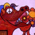 Mural al santuario di Madonna di Briano. Particolare: il drago della pace che sputa fiori anziché fuoco.