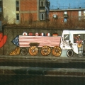 Mural antivertice G7. Fermiamo il treno dei problemi. - Via Cintia - Soccavo - Napoli. La locomotiva, guidata dal sassofonista Clinton.