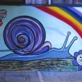 “Il Treno dei diritti va troppo lento” Mural alla Scuola Media “Carlo Levi” (Scampia, Napoli), 1999. L’a lumaca che traina il treno dei diritti (particolare).