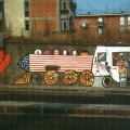 Mural antivertice G7. Fermiamo il treno dei problemi. - Via Cintia - Soccavo - Napoli. La locomotiva, guidata dal sassofonista Clinton.