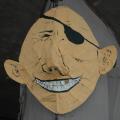 La faccia di Berlusconi-pirata con il dente d